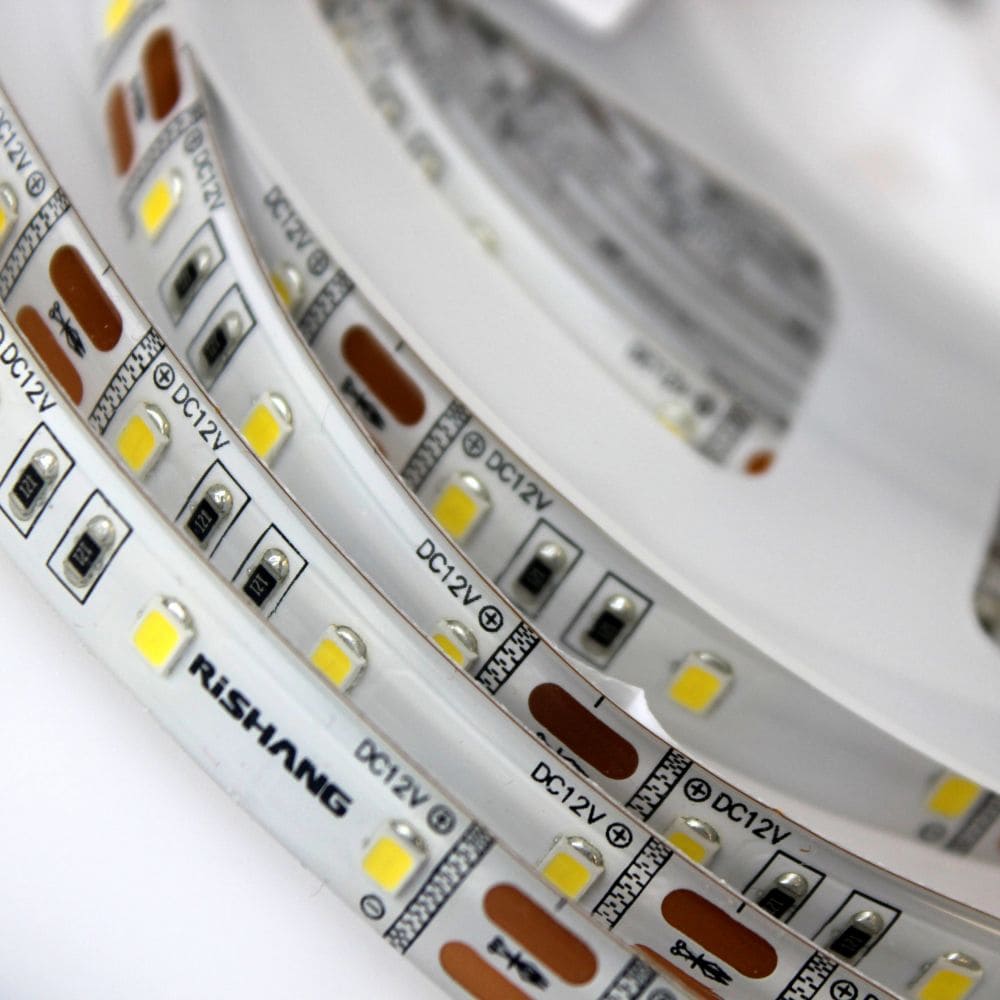 Світлодіодна стрічка RISHANG 3000K, 12 Вт/м, 2835, 60 діодів, IP65, 12V, 900 lm, тепле світло